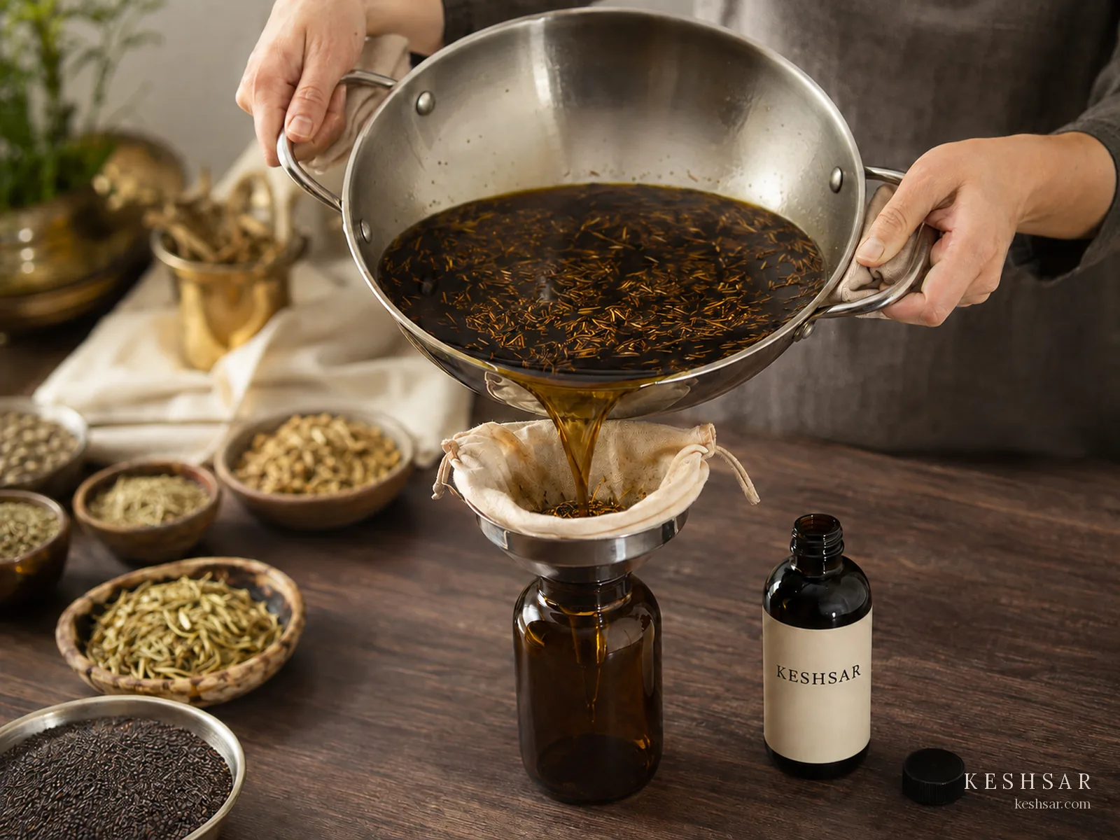 Infused oil being strained during preparation